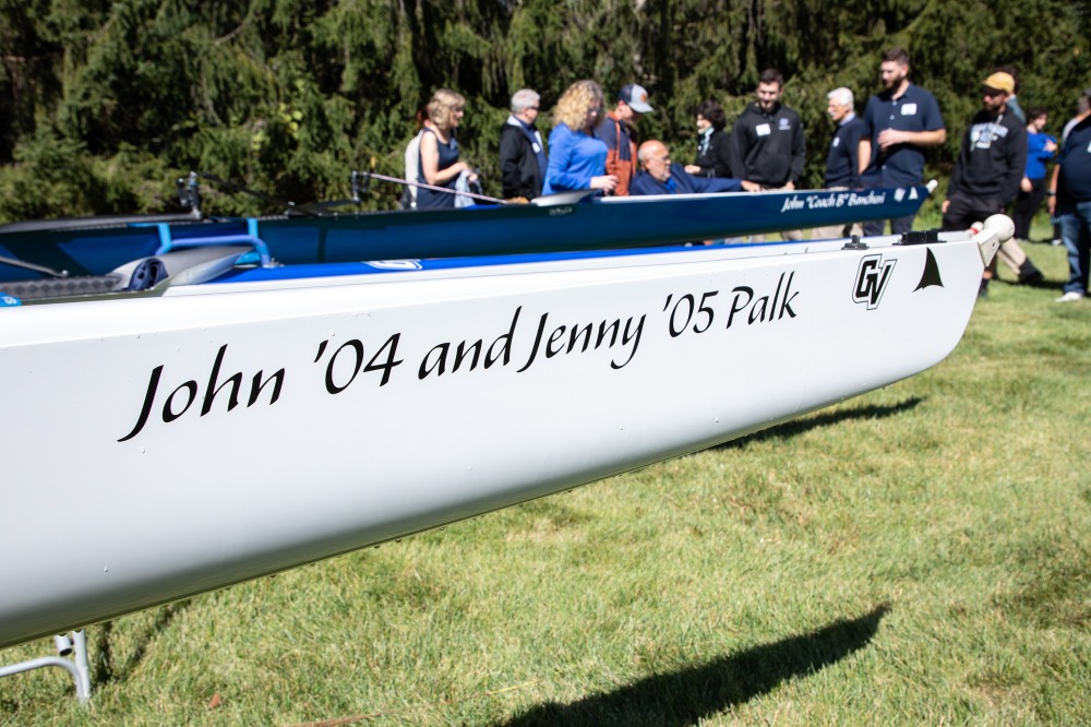 John '04 and Jenny '05 Palk written on side of boat